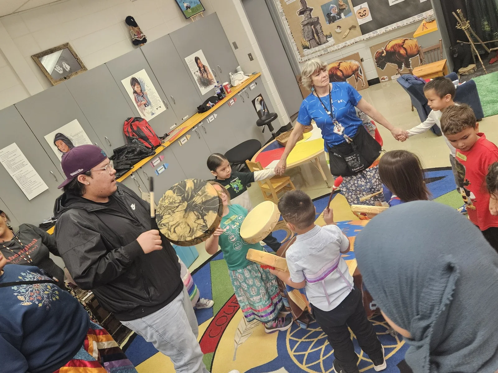 The drumming circle seen from another corner of the room.