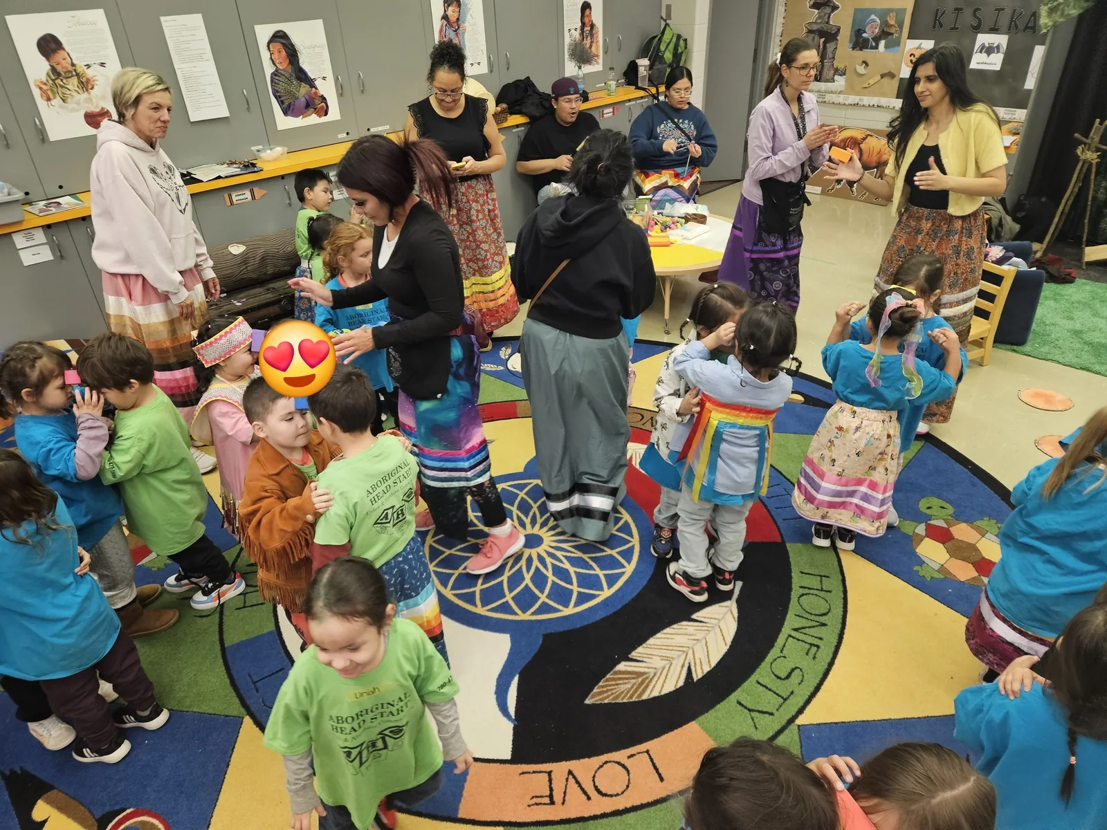 The circle seen from above, children pressed in around the centre.